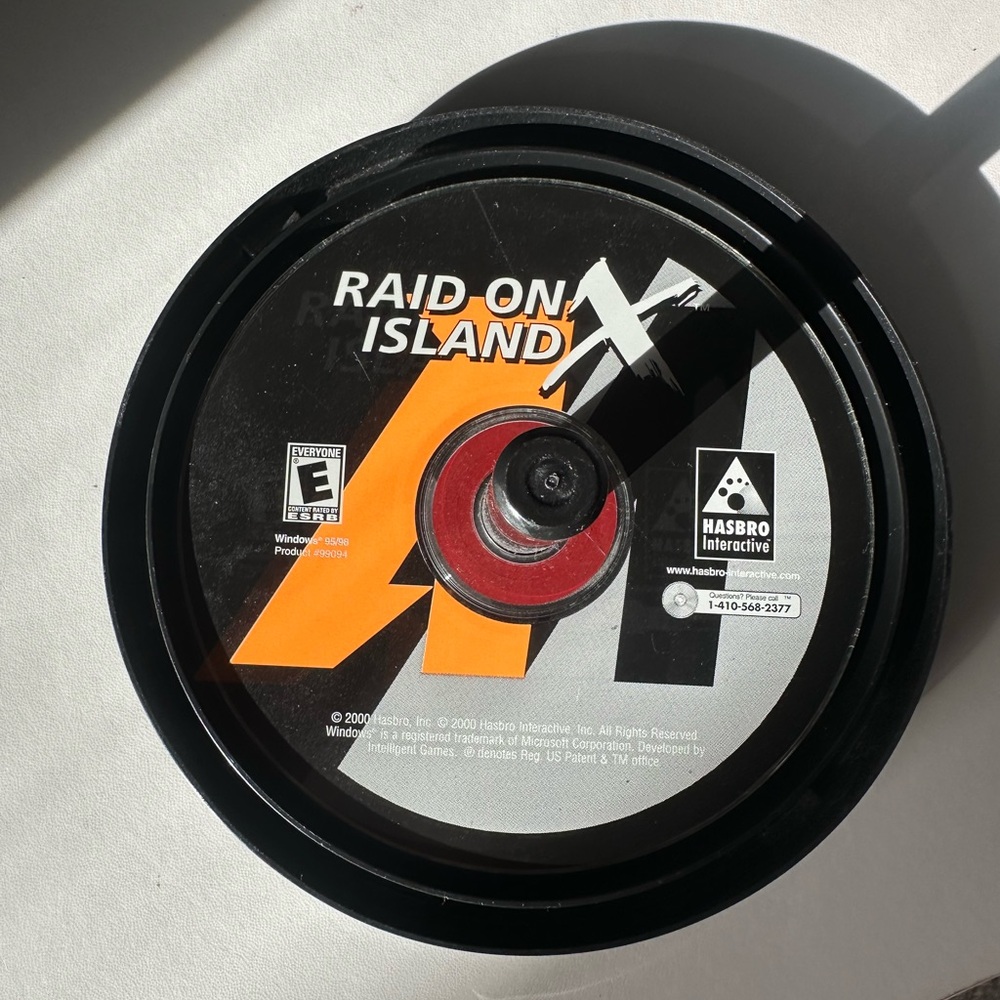 Raid on Island Video Game Disc by Hasbro Interactive - Black, Orange, White